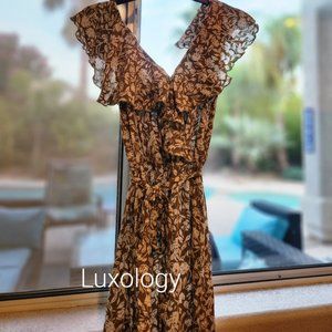 Sleeveless jumpsuit with ruffle neckline